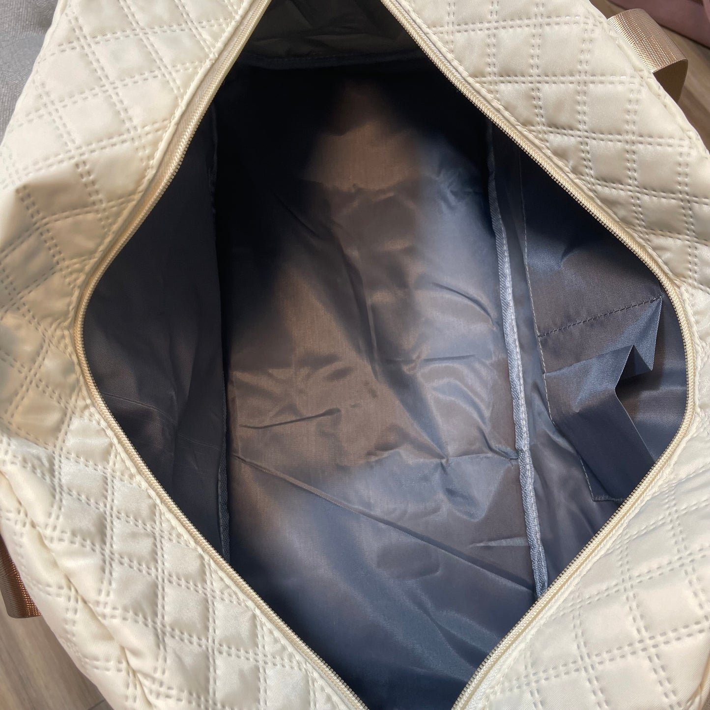 Cream duffel bag